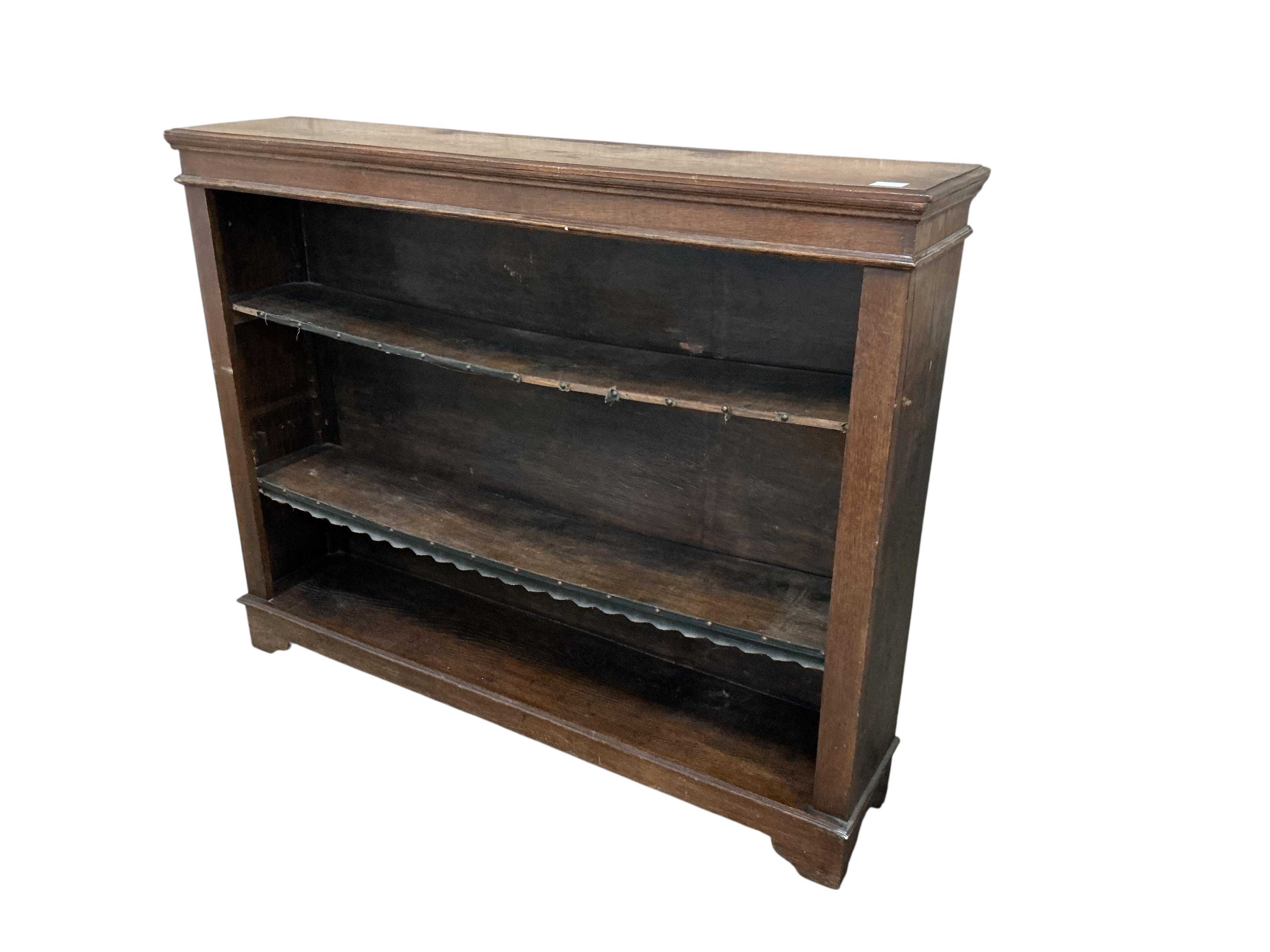 A Victorian oak open bookcase, width 138cm, depth 29cm, height 106cm